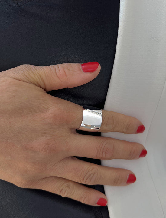 Female model wearing RICH wide thick bold chunky statement cigar band ring in 925 sterling silver by Sonia Hou, a celebrity AAPI Chinese demi-fine jewelry designer