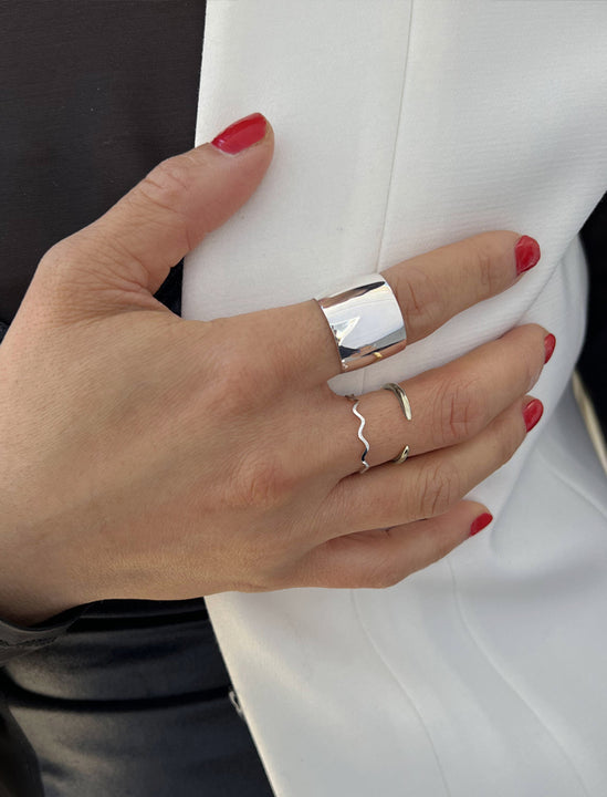 Female model wearing wide RICH thick bold chunky statement cigar band ring in 925 sterling silver by Sonia Hou, a celebrity AAPI Chinese demi-fine jewelry designer