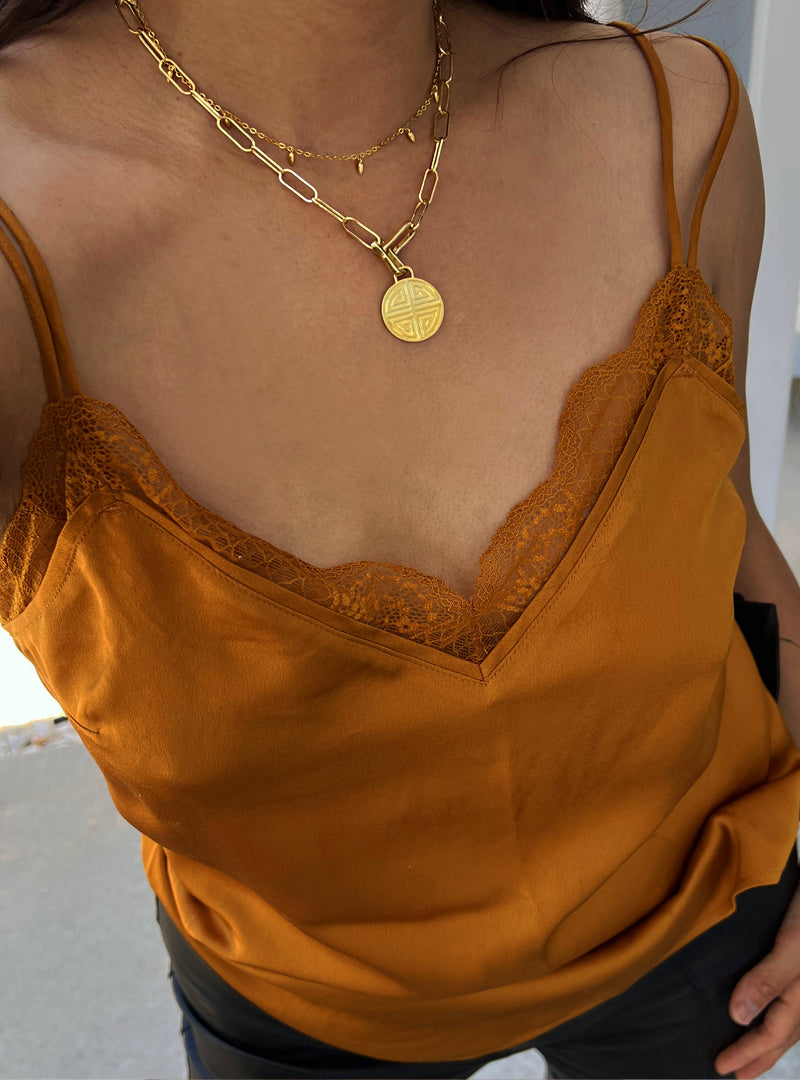 Female model wearing inclusive Asian inspired thin Rice bead minimalist chain layering stacking necklace in 18K gold vermeil with a 925 sterling silver base by Sonia Hou, a celebrity Chinese AAPI demi-fine jewelry designer