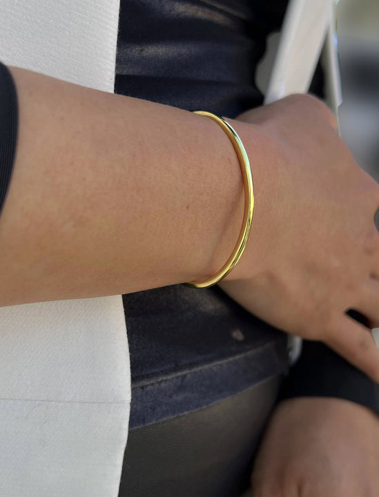 Female model wearing Success 18K Gold Vermeil Sterling Silver Thin 2-Way Cuff Band Bangle Stacking Bracelet by Sonia Hou Jewelry