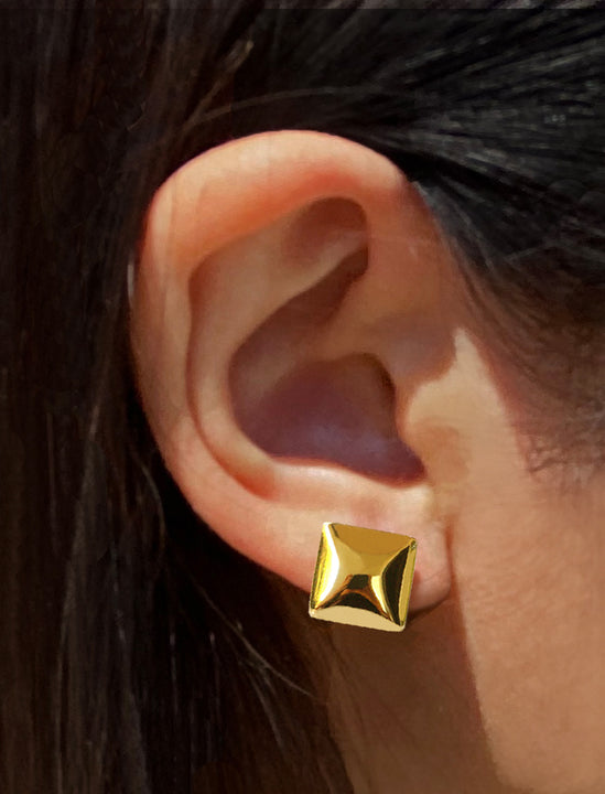 Female model wearing inclusive, minimalist SQAURE stud small chunky bold thick statement earrings in 18K Gold Vermeil with 925 Sterling Silver base by Sonia Hou, a celebrity AAPI Chinese demi-fine jewelry designer