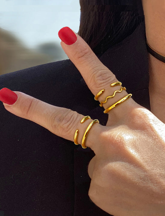 Female model wearing adjustable minimalist Success Simple Midi Thick Chunky Thin Bold Layering Stacking Statement 2 Way Convertible Band Open Ring in 18K Gold Vermeil with 925 sterling silver base by Sonia Hou, a celebrity AAPI Chinese demi-fine fashion costume jewelry designer