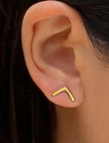 Female model wearing small modern geometric minimalist simple 2-way convertible TRILL dainty wishbone diamond front back ear jacket stud earrings in 18K gold vermeil with 925 sterling silver base by Sonia Hou, a celebrity AAPI Chinese demi-fine fashion costume jewelry designer