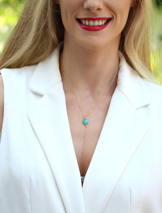 Girl Model Wearing A Lariat Gold Y Necklace In Blue Magnesite Gemstone by SONIA HOU Jewelry